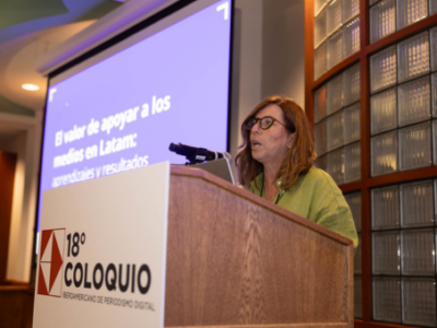 Woman in glasses at podium